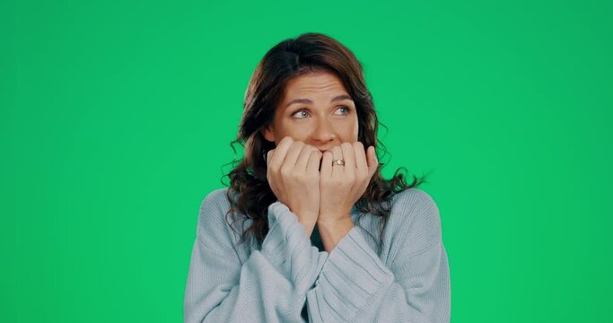 Fear, anxiety and biting nails with woman in studio for scared, terror and mental health on green screen background. Fail, risk and worry with female and phobia for panic, frustration and nervous