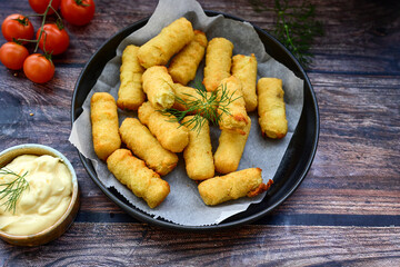  Traditional fried  Potato Croquettes with Cheese  dipping sauce on wooden board