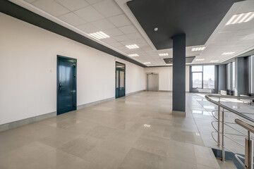empty modern hall room with columns, doors and panoramic windows.