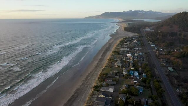 Rockaway Beach, Oregon Northbound Aerial Flyover looking toward Manzanita and Mount Neah Kah Nie, Evening