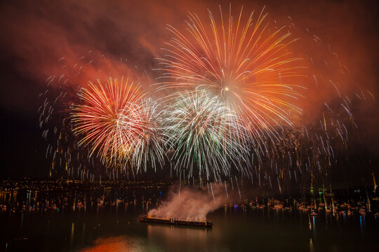 Colorful fireworks exploding at English Bay against sky