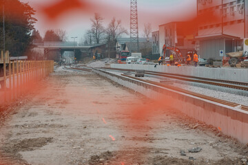 Modernization of older train station of Domzale, suburb city of ljubljana. Workers laying new...