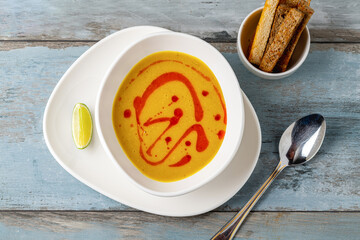 Strained lentil soup on a white porcelain plate