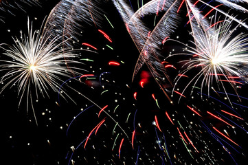 Low angle view of fireworks against sky