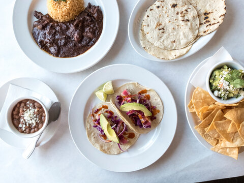 Overhead view of food served in plates on table