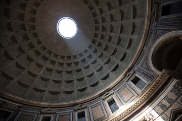 Low angle view of sunlight falling from hole at Pantheon