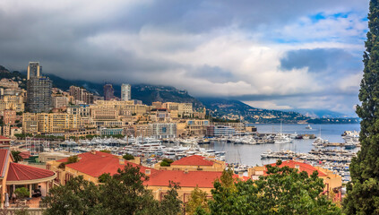 Fototapeta na wymiar Panorama of the skyline and Monte Carlo Harbor with luxury yachts in Monaco