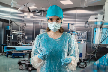 Fototapeta na wymiar doctor standing in an operating room in a modern clinic stands with a stethoscope waiting