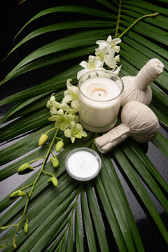 Healthy Concept, white orchid flower ,spa ball,salt in bowl,, Spa with candle and stone spa