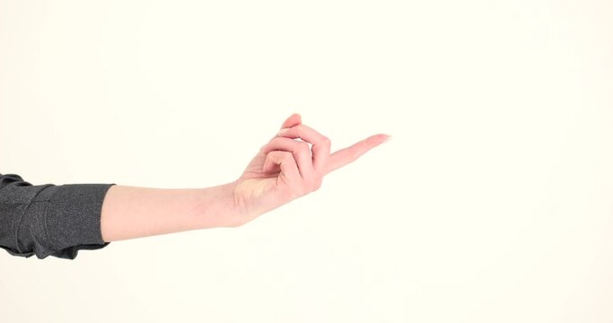 Female index finger calling on white background closeup 4k movie slow motion