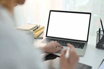 Businessman using laptop contact business, search information on office desk. Empty screen for marketing and creative design