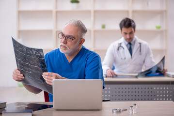 Two male doctors radiologists working in the clinic