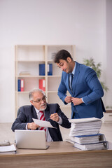 Fototapeta premium Two male colleagues working in the office
