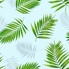 seamless pattern green palm leaves and shadows on a light blue background
