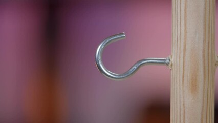 Person almost won ring toss game at local fair, macro close up