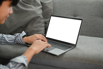Cropped shot of asian ,am hands typing some information on laptop. White screen and blank space for text