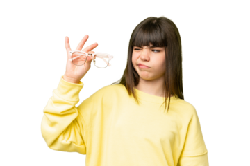 Little girl with glasses over isolated chroma key background with sad expression