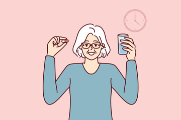 Elderly woman with pill and glass of water stands near clock following doctor prescriptions and recommendations for treatment. Concept of calendar or schedule for taking medications for treatment 