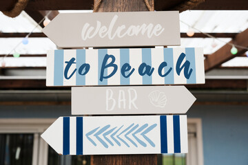 sign welcome to the beach bar