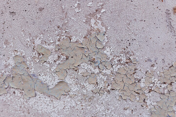 Rough wall with a pink and beige tint.