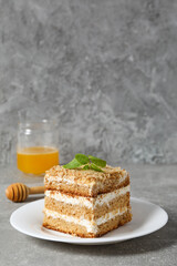 Concept of delicious sweet food - honey cake, space for text