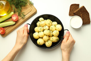 Concept of tasty food with boiled young potatoes, top view