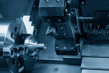 The CNC lathe machine thread cutting at the end of metal cone shape parts.