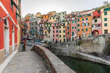 Italy, Liguria, Riomaggiore,Waterfront row houses in historic town along Cinque Terre