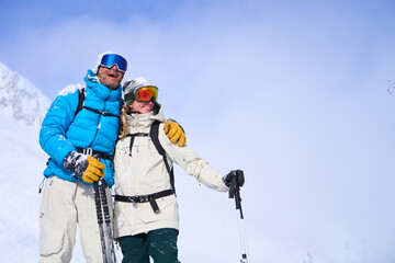 Happy couple with arm around on sunny day