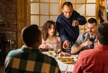 Chef serving food at restaurant