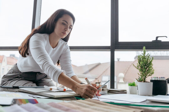 Interior designer working on design at workplace