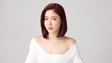 Beautiful young asian woman with clean fresh skin on grey background, Face care, Facial treatment, Cosmetology, beauty and spa, Asian women portrait.