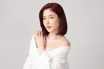 Beautiful young asian woman with clean fresh skin on grey background, Face care, Facial treatment, Cosmetology, beauty and spa, Asian women portrait.