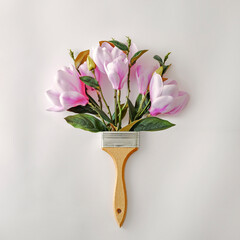 Minimal creative bouquet with flowers and paint brushes for paint. Minimal playful concept of...