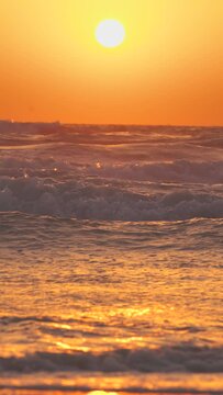4k Vertical Shot Sun Shine Above Sea Ocean During Sunset. Sea Ocean With Waves. Wave Water Foam Splashes At Sunset. Sundown Vacation Vetical Background. Tropical Resort Concept. Beautiful Light.