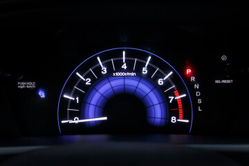 Сar dashboard close-up with tachometer during parking