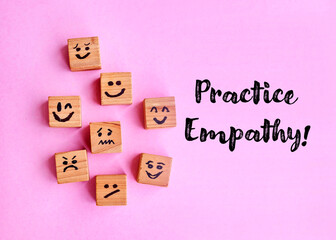 Many cubes with different emotions on pink  background . Practice empathy Concept   - obrazy, fototapety, plakaty