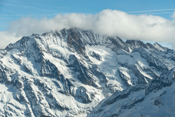 Fantastic snow covered mountain panorama at the Eigergletscher in Switzerland