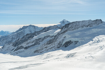 Fototapeta na wymiar Incredible alpine scenery from the top of the Jungfraujoch in Switzerland