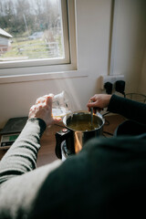 A scientist pouring liquid 