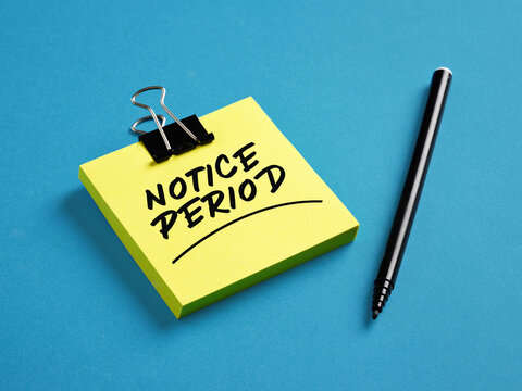The word notice period on yellow sticky note paper with a black pen on blue background. Business job resignation announcement concept.