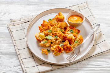 baked Cauliflower florets with sauce on plate
