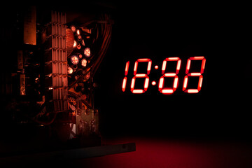 clock and electronic components on a dark background