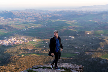 Obraz premium Standing here in this picturesque location, dressed in my finest outfit, I feel like I can conquer the world and nothing can stop me