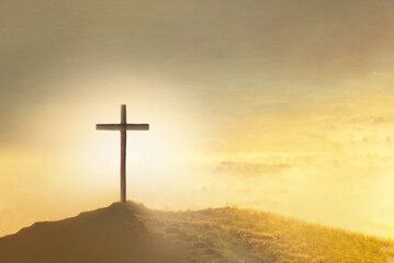 Christian Easter. Shining cross in clouds on golden sky. Ascension day concept. Faith in Jesus...