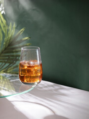 Iced tea with orange and citrus flavor. Summer drink. Iced tea with ice.