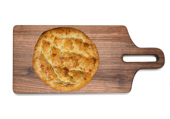 ramadan pita on wooden board. Traditional Ramadan bread.