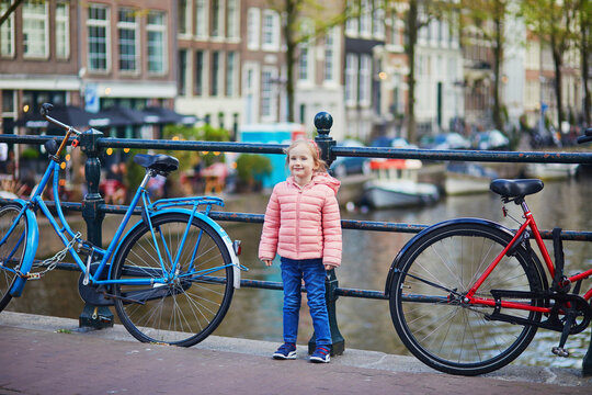 Preschooler girl on a bridge in Amsterdam, the Netherlands