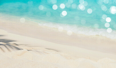 Fototapeta na wymiar Summer vacation concept with palm shadow on tropical sandy beach