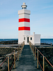 Main red and white lighthouse with bridge